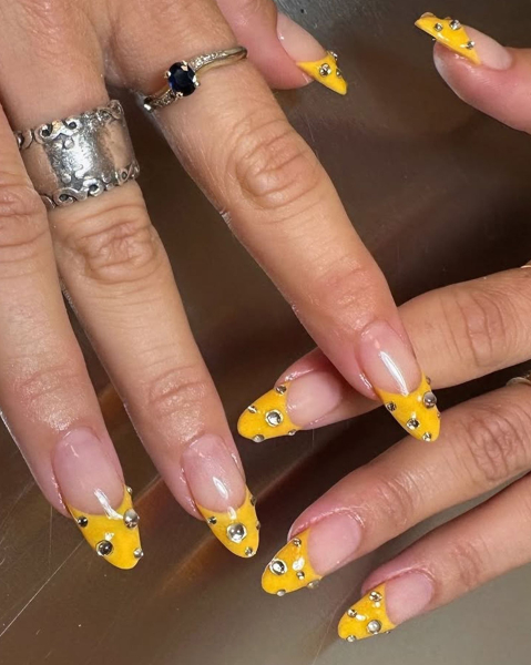 nail trends 2026 studded french manicure with yellow tip