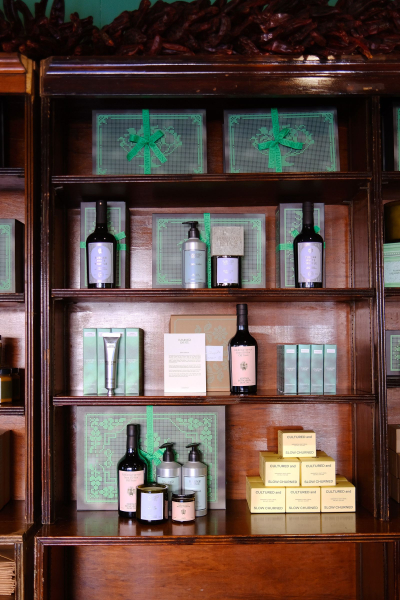 wood shelf with green products on it